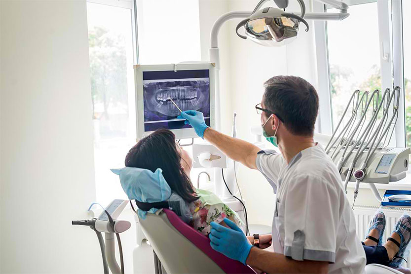 Photo of dentist and patient
